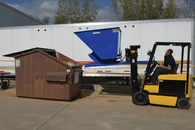 Vestil D-200-LD d style - self-dumping steel hoppers with bumper release shown from an alternate angle